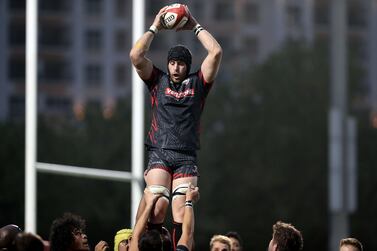Exiles' Jaen Botes climbs high in the lineout during the game between Dubai Tigers and Dubai Exiles in the UAE Premiership in Sports City, Dubai. Chris Whiteoak/ The National