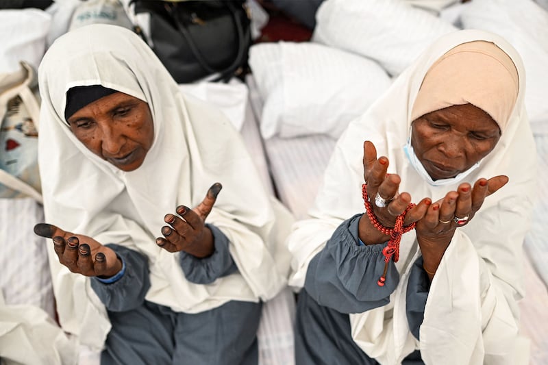 Pilgrims pray upon their arrival in Mina, near Islam's holy city of Makkah. AFP