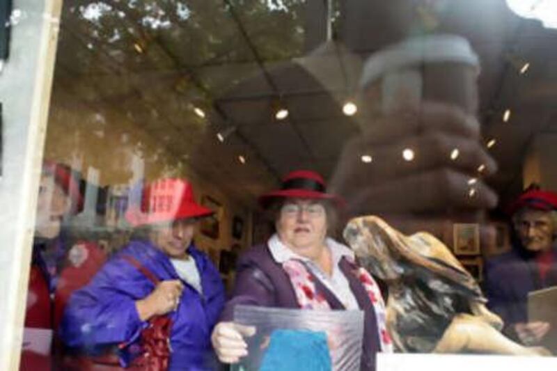 Anna Carey, centre, with some fellow Red Hat Society members visiting an art gallery in Baltimore, Maryland.
