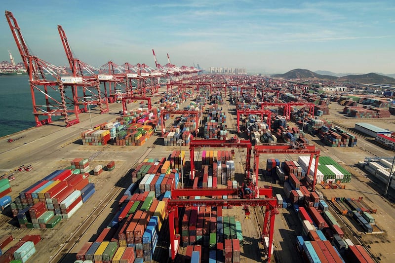 An aerial view of a port in Qingdao, east China's Shandong province on November 8, 2018.  China's exports to the US and the rest of the world grew more than expected in October, official data showed on November 8, as its traders apparently rushed shipments across the Pacific ahead of higher tariffs. - China OUT
 / AFP / STR

