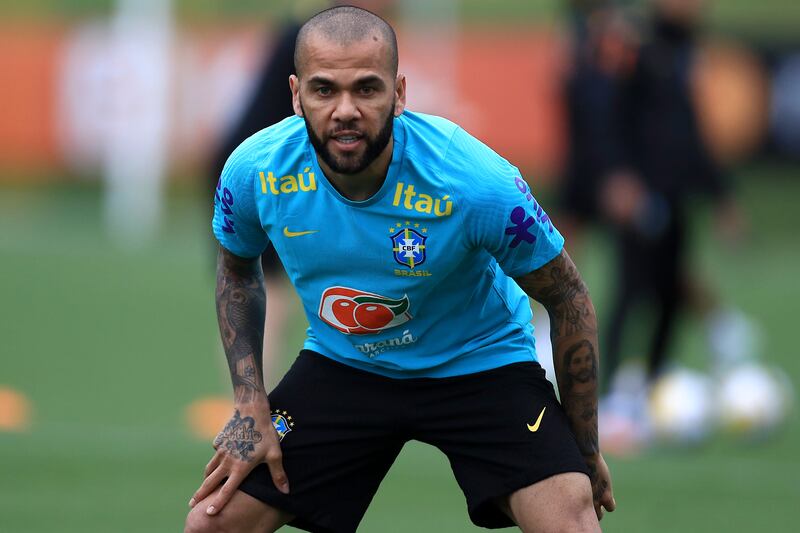 Daniel Alves looks on during a training session at the Granja Comary training complex. Getty