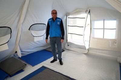 DUBAI, UNITED ARAB EMIRATES , Jan 29  – 2020 :- Muhammad Yaqoob , Head of Office , Senior Global Supply Officer showing the new tents for emergency help at the UNHCR warehouse at the International Humanitarian City in Dubai. ( Pawan  Singh / The National ) For News. Story by Kelly