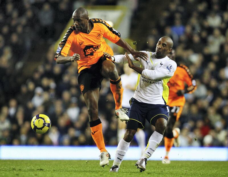 LONDON, ENGLAND - NOVEMBER 22:  Jermain Defoe of Tottenham Hotspur is challenged by Emmerson Boyce of Wigan Athletic during the Barclays Premier League match between Tottenham Hotspur and Wigan Athletic at White Hart Lane on November 22, 2009 in London, England.  (Photo by Clive Rose/Getty Images)