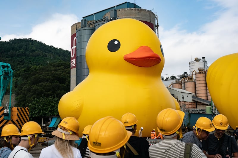 HONG KONG, CHINA - MAY 25: Giant inflatable rubber duck sculptures are seen in Tsing Yi on May 25, 2023 in Hong Kong, China. The 18-metre-tall inflatable sculptures are some of the tallest rubber ducks in the world, created by Dutch artist Florentijn Hofman. The duck duo will make their official debut in a large-scale public art exhibition "DOUBLE DUCKS by Flotentijn Hofman" curated by AllRightsReserved later this year. (Photo by Anthony Kwan / Getty Images)