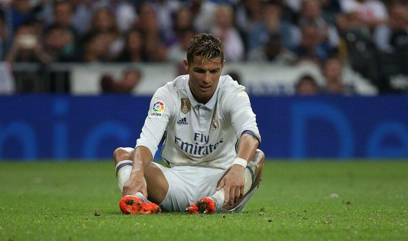 Real Madrid’s Cristiano Ronaldo looks dejected after Messi’s winning goal. Sergio Perez / Reuters