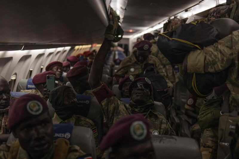 South Sudanese soldiers, part of the East African Community Regional Force, sit in a plane at Goma airport before leaving the Democratic Republic of Congo. AFP