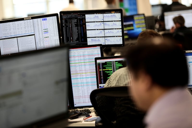 Traders on the IG Index trading floor in London. London shares hit several record highs this week on low valuations, a weak pound and a takeover bid for Anglo American. Reuters
