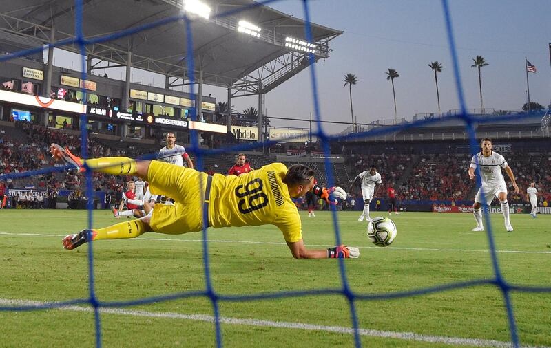 AC Milan goalkeeper Gianluigi Donnarumma stops a shot. AP Photo
