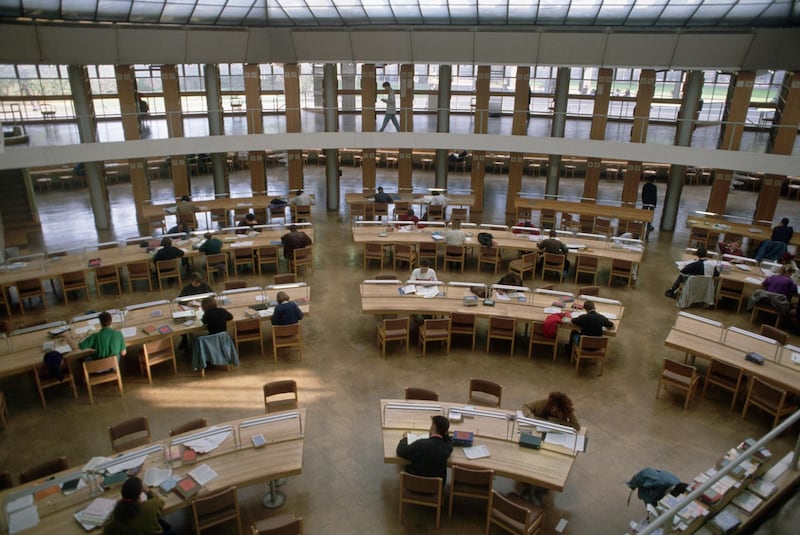 Students study in a new library at Cambridge University. England, UK. Getty Images