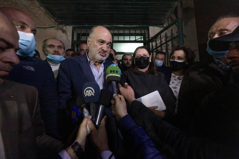 Former Fatah official Nasser Al Kidwa, centre left, and Marwan Barghouti's wife, Fadwa, centre right, leave the Palestinian Central Election Commission office after registering their joint list for the coming parliamentary election in May. AP