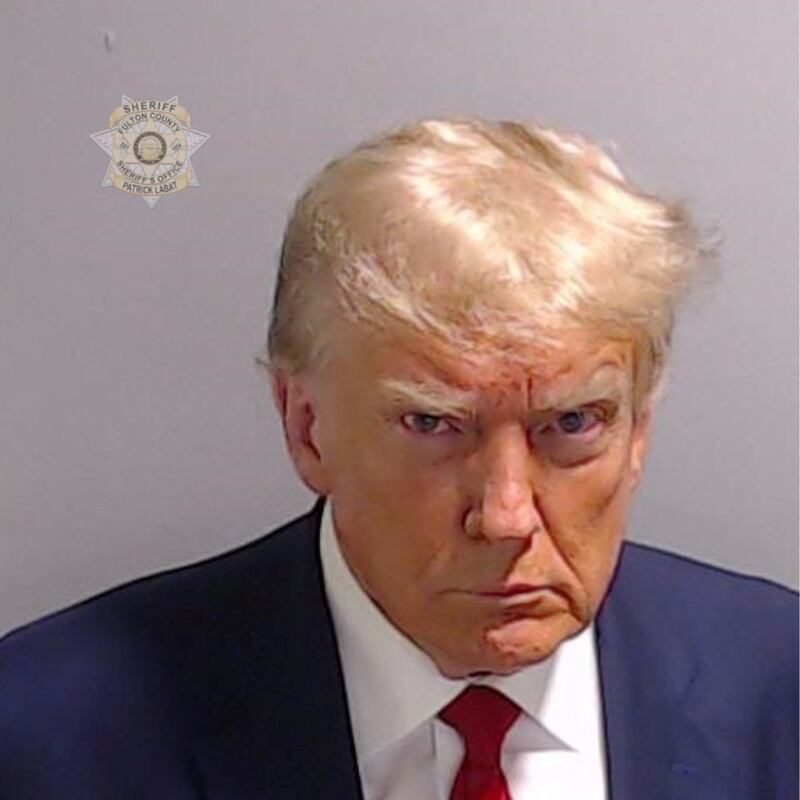 Former US president Donald Trump's mugshot was released after his arrest for conspiracy to overturn an election in Georgia. Reuters