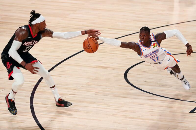 Houston Rockets forward Robert Covington, left, and Oklahoma City Thunder guard Dennis Schroder  battle for a loose ball during the second half of game seven of the first round of the 2020 NBA Play-offs at ESPN Wide World of Sports Complex in Florida. USA TODAY Sports