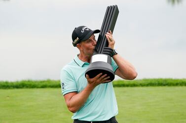 Henrik Stenson, of Sweden, kisses the trophy after winning the individual competition of the LIV Golf Invitational at Trump National in Bedminster, N. J. , Sunday, July 31, 2022.  (AP Photo / Seth Wenig)