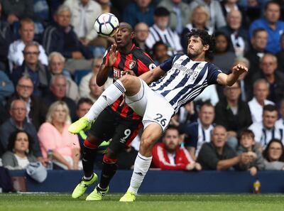 WEST BROMWICH, ENGLAND - AUGUST 12:  Ahmed El-Sayed Hegazi of West Bromwich Albion clears from Benik Afobe of AFC Bournemouth during the Premier League match between West Bromwich Albion and AFC Bournemouth at The Hawthorns on August 12, 2017 in West Bromwich, England.  (Photo by David Rogers/Getty Images)