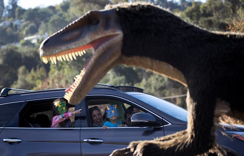People drive through the Jurassic Quest Experience outside The Rose Bowl Stadium in Pasadena, California. Reuters