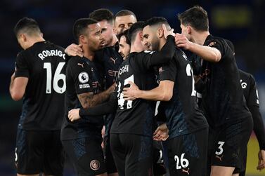 Riyad Mahrez of Manchester City is congratulated by Phil Foden and teammates after scoring the second goal against Everton. Getty
