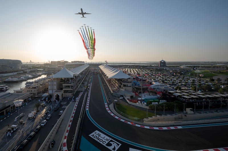 The Al Fursan aerobatic team and an Etihad plane perform a flyover prior to the race at Yas Marina Circuit. UAE Presidential Court