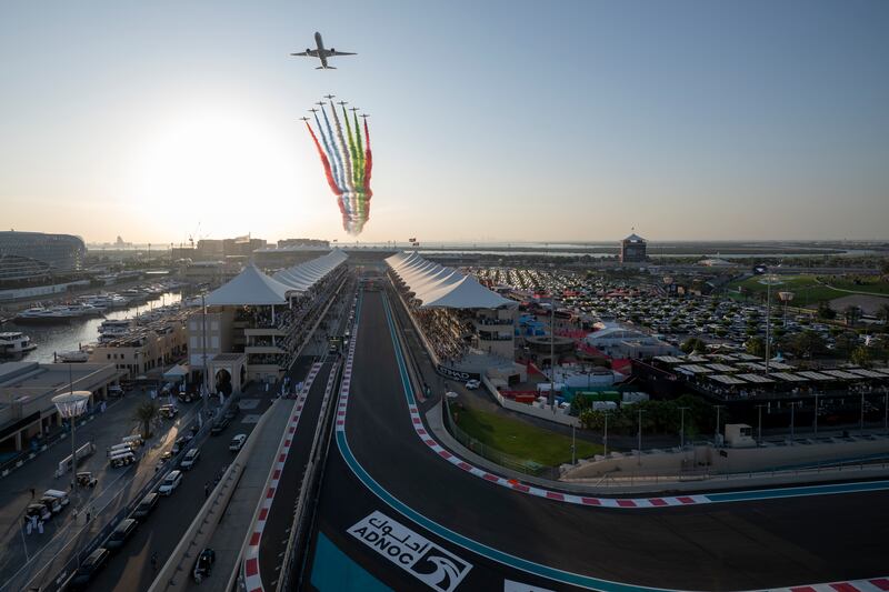 The Al Fursan aerobatic team and an Etihad plane perform a flyover prior to the race at Yas Marina Circuit. UAE Presidential Court