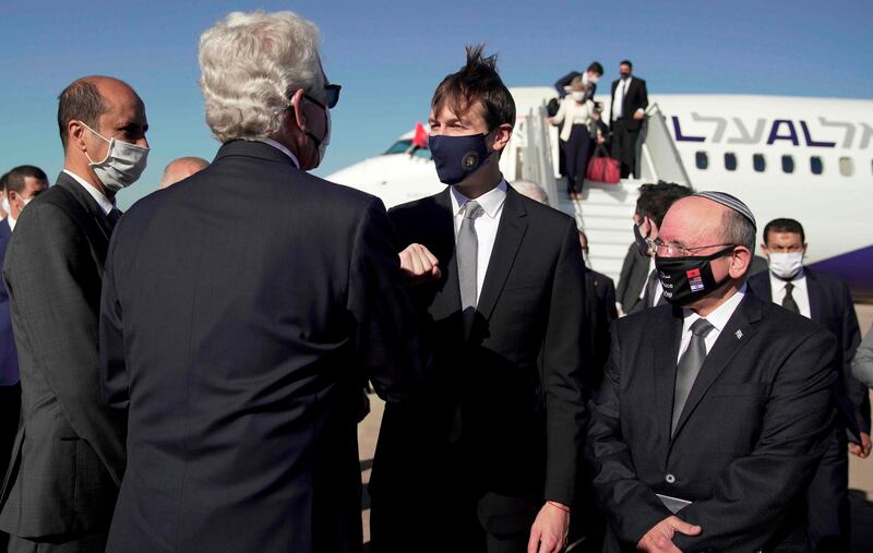 A handout picture released by the US Embassy in Morocco , shows US Ambassador David T. Fischer (2nd L) welcoming US Presidential advisor Jared Kushner and Israeli National Security Advisor Meir Ben Shabbat (R) in Moroco's capital Rabat, upon landing of the first Israel-Morocco direct commercial flight, marking the latest US-brokered diplomatic normalisation deal between the Jewish state and an Arab country. AFP