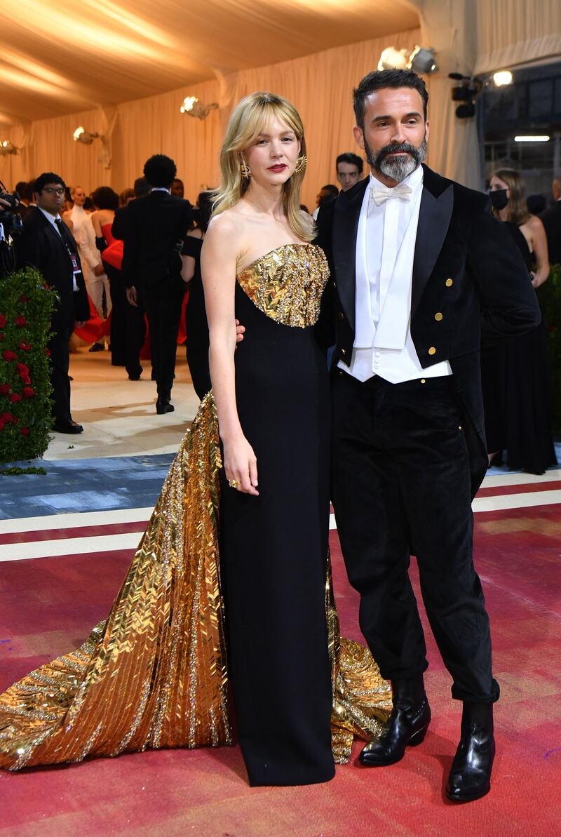Fashion designer Daniel Roseberry and British actress Carey Mulligan, who wore a gown with a gold bodice and train by Schiaparelli. AFP 