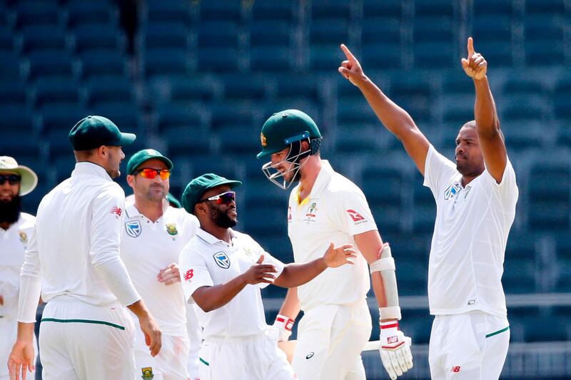 South African bowler Vernon Philander (R) celebrates the dismissal of Australian batsman Pat Cummins (2R) on the fourth day of the fifth Test cricket match between South Africa and Australia won by South Africa at Wanderers cricket ground on April 3, 2018 in Johannesburg.  / AFP PHOTO / GIANLUIGI GUERCIA