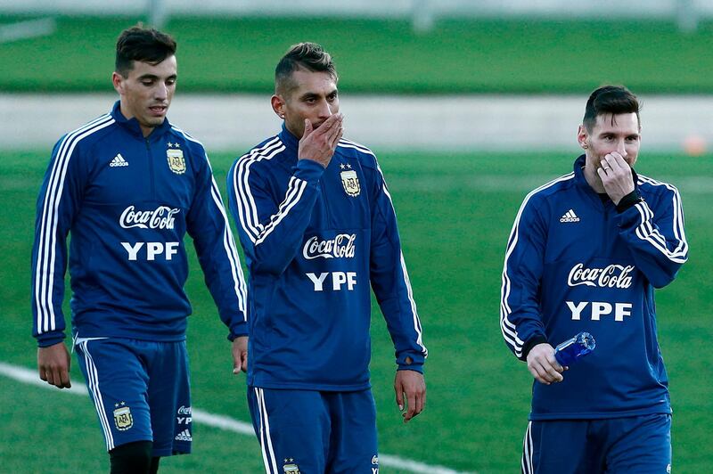 Argentina players Lionel Messi, right, midfielder Roberto Pereyra attend a training session at the Real Madrid's training facilities of Valdebebas. AFP