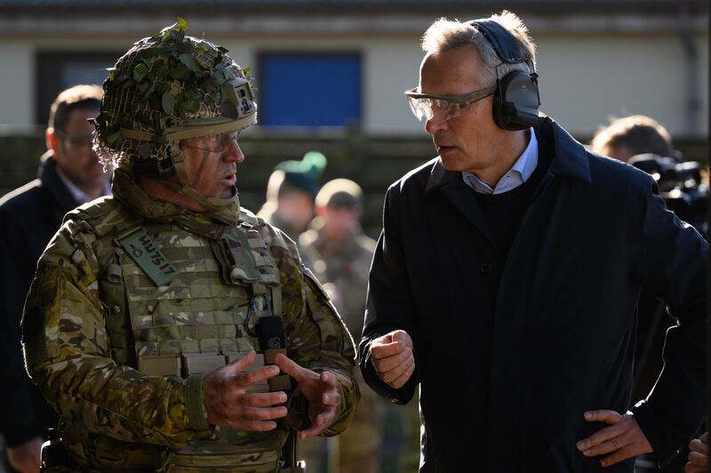 Mr Stoltenberg is shown a series of displays. 