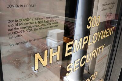 FILE - In this April 16, 2020 file photo, a note on a locked door at the New Hampshire Employee Security center, which handles unemployment claims, gives directions to those in need in Manchester, N.H. The U.S. unemployment rate hit 14.7% in April, the highest rate since the Great Depression, as 20.5 million jobs vanished in the worst monthly loss on record. The figures are stark evidence of the damage the coronavirus has done to a now-shattered economy.  (AP Photo/Charles Krupa, File)