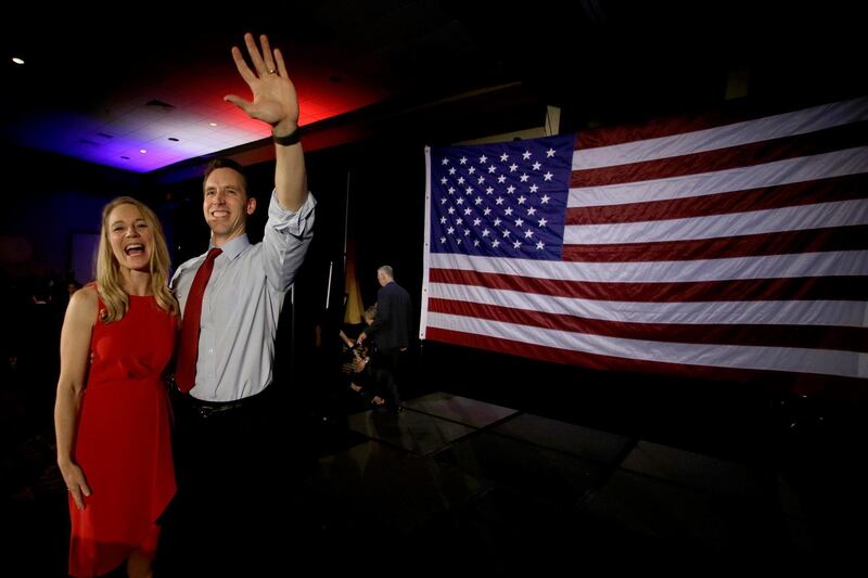 Missouri Senator-elect Josh Hawley with his wife Erin waves to supporters after giving his victory speech in Springfield, Missouri. AP Photo