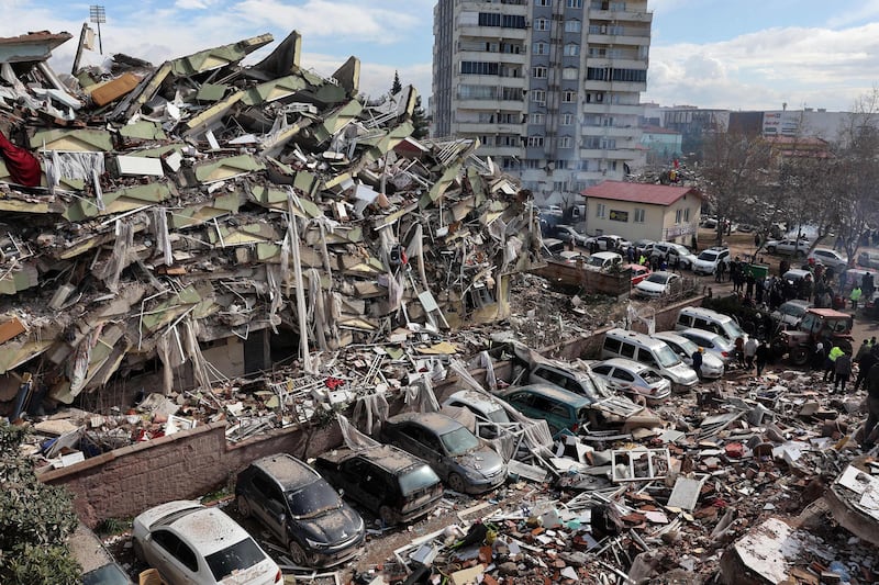 Rescuers look for survivors under the rubble of collapsed buildings in Kahramanmaras, close to the quake's epicentre. AFP