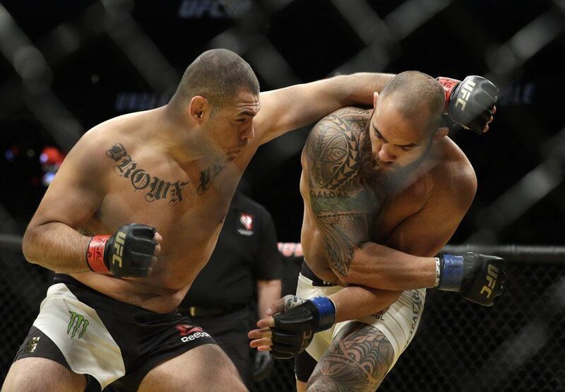 Cain Velasquez, left, fights Travis Browne during their heavyweight bout at UFC 200, Saturday, July 9, 2016, in Las Vegas. John Locher / AP Photo