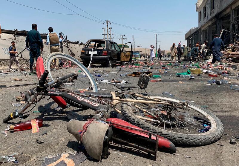 A damaged bicycle is seen at the site of a suicide attack in Kabul, Afghanistan, Thursday, July 25, 2019. Afghan police say a suicide bomber blew himself up Thursday in front of a bus carrying Ministry of Mines employees. (AP Photo/Rahmat Gul)