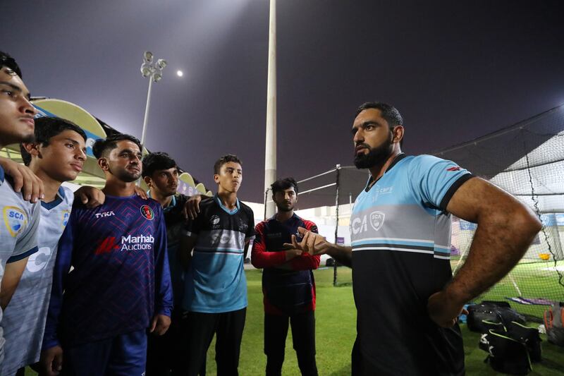 Coach Niaz-ul-Islam speaks to young Afghan cricketers training at the Sharjah Cricket Academy in Sharjah. All pictures by Chris Whiteoak / The National