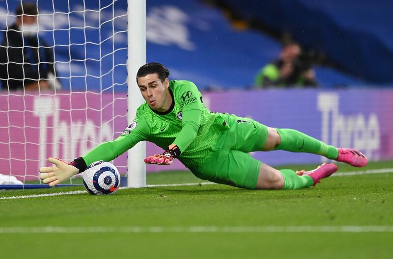 Chelsea's goalkeeper Kepa Arrizabalaga takes a safe during the English Premier League soccer match between Chelsea and Arsenal at Stamford Bridge stadium in London, England, Wednesday, May 12, 2021. (Shaun Botterill, Pool via AP)