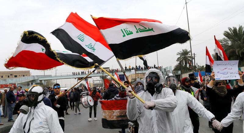 University students carry Iraqi flags during ongoing anti-government protests in Baghdad, Iraq. Reuters