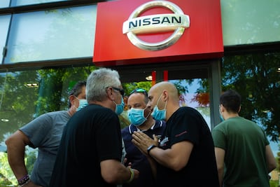 epa08449582 Nissan workers chat as they are gathered in front of a Nissan authorized dealer after the company announced its plans of shutting down the plant placed in Zona Franca industrial state in Barcelona, Spain, 28 May 2020. Japanese carmaker Nissan reported that it will dismantle Barcelona's facilities affecting up to 30,000 direct and indirect jobs after some 40 years of business.  EPA/Enric Fontcuberta