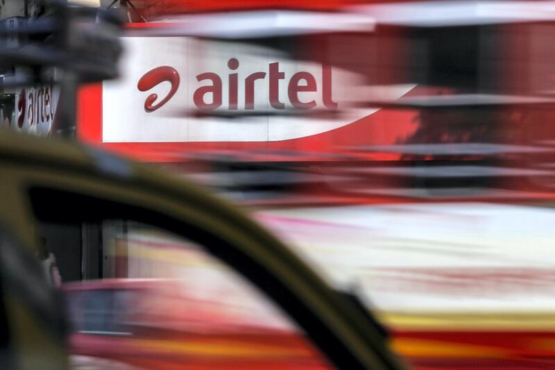Motorist drive past a Bharti Airtel Ltd. store in Mumbai, India, on Saturday, April 21, 2018. Bharti Airtel are scheduled to release earnings on April 24. Photographer: Dhiraj Singh/Bloomberg