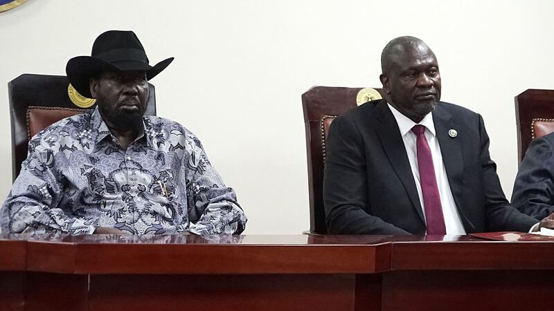 South Sudanese President Salva Kiir, left, and Vice President Riek Machar at the signing ceremony at Juba on April 3. AFP