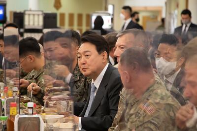 South Korean President-elect Yoon Suk Yeol, centre, shares a meal with South Korean and US military officials during his visit to Camp Humphreys in Pyeongtaek, South Korea, last month. AP Photo