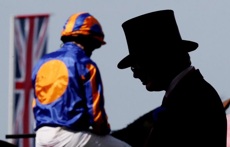 A jockey and racegoer at Royal Ascot in England on Tuesday, June 15. Reuters