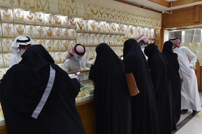 Saudis shop at a jewellery shop in the Tiba gold market in the capital Riyadh.  AFP
