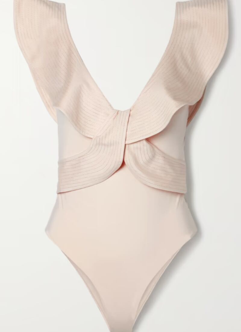 Ruffled swimsuits: from the luxe material and plunging neckline to the low-key ruffles and creamy ecru colour, this swimsuit by Johanna Ortiz will match with all beach accessories; Dh1,540.14, Johanna Ortiz at netaporter.com. Photo: Net-a-Porter