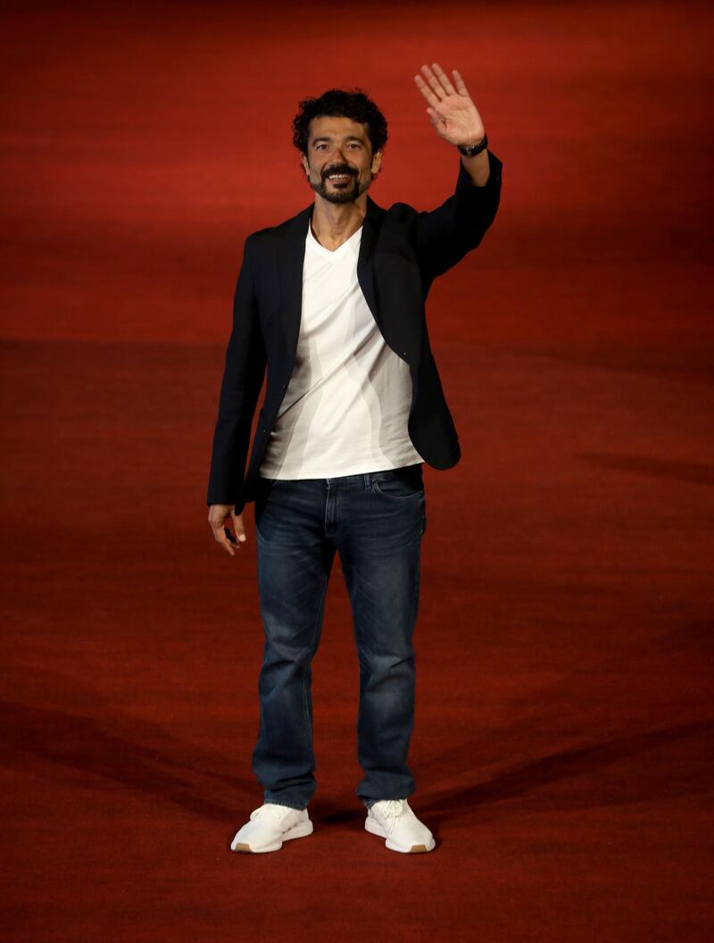 Egyptian actor Khaled Al-Nabawi walks the red carpet during the fourth El Gouna Film Festival on October 25, 2020. AFP