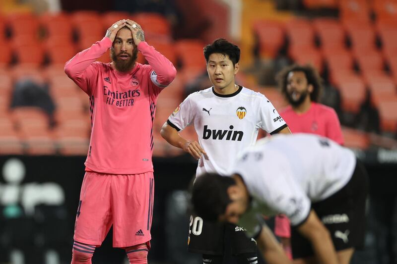 Sergio Ramos can't believe it as Carlos Soler  prepares to take another penalty. Getty