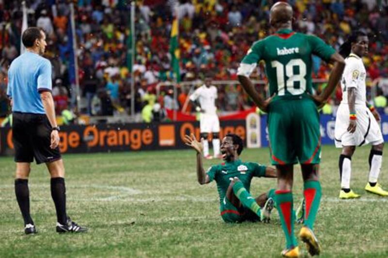 Burkina Faso's Jonathan Pitroipa reacts after receiving a second yellow card against Ghana.