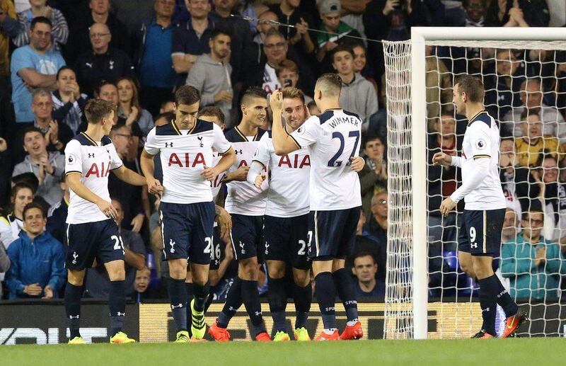 Tottenham’s Christian Eriksen celebrates scoring their second goal with teammates. Neil Hall / Reuters