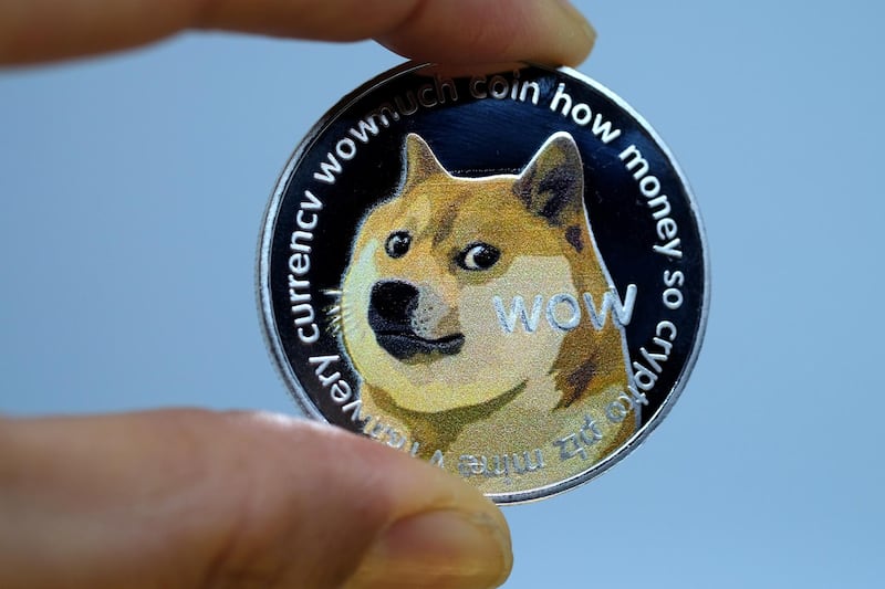 KATWIJK, NETHERLANDS - JANUARY 29: In this photo illustration a visual representation of digital cryptocurrency, Dogecoin is displayed on January 29, 2021 in Katwijk, Netherlands.  (Photo by Yuriko Nakao/Getty Images)