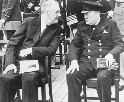 American president Franklin Delano Roosevelt (1882 - 1945) meets British prime minister Winston Churchill (1874 - 1965) for a church service on board the HMS Prince of Wales in Placentia Bay, Newfoundland, August 1941. They have convened for the Atlantic Conference to negotiate the Atlantic Charter.  (Photo by Fox Photos/Hulton Archive/Getty Images)