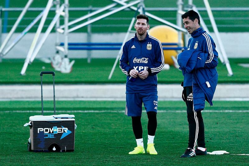 Lionel Messi takes a break during a training session. AFP