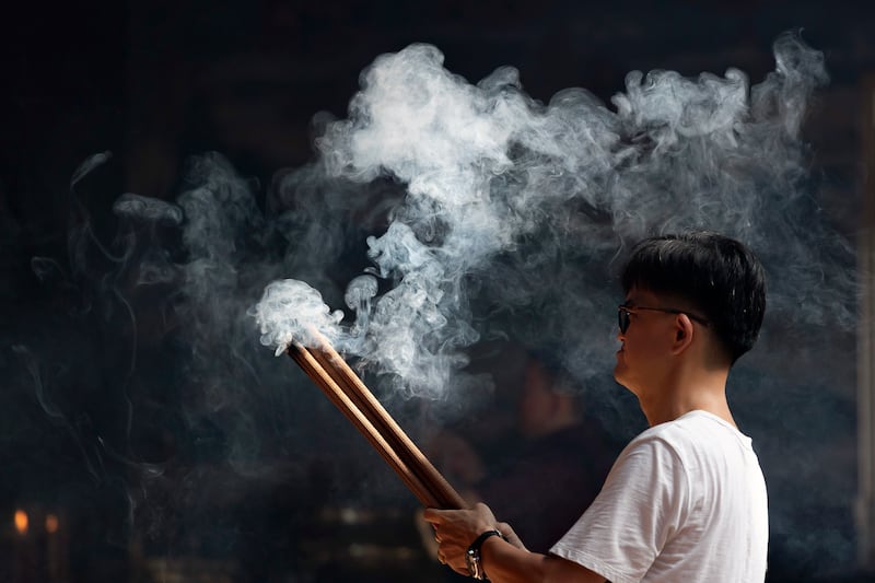 Incense and prayers during Lunar New Year celebrations at a temple in Denpasar, Bali, Indonesia, where Lunar New Year is known as Imlek. EPA